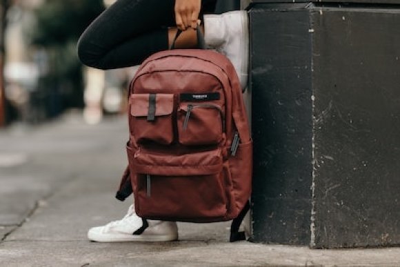 boy holding backpack
